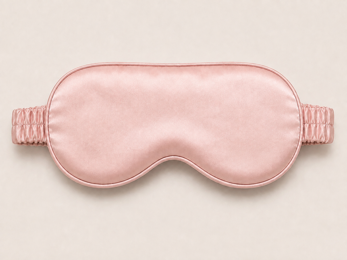 ANELA Blush mulberry silk eye mask, front view with a silk-covered elastic strap
