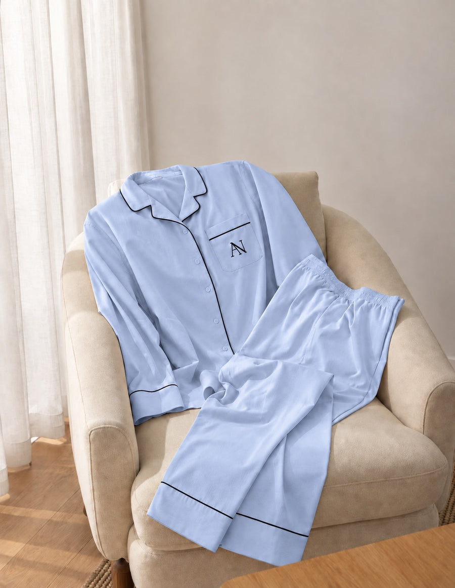Bamboo Long Pyjama Set in Blue Haze. Complete set with black piping and the AN pocket monogram.